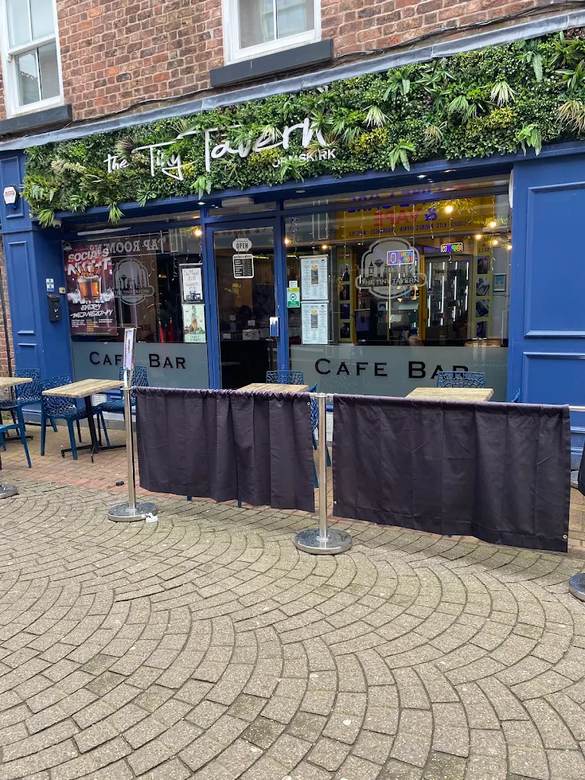The Tiny Tavern shopfront on Burscough Street, Ormskirk, with outdoor tables